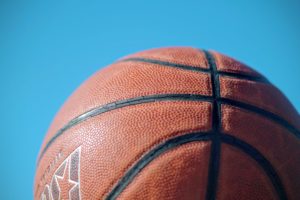 picture of a basketball with blue sky behind it